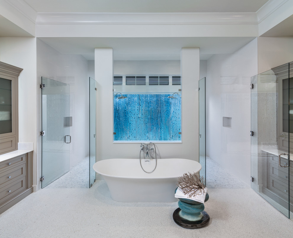 Inspiration for a master bathroom in Miami with a freestanding tub and a double shower.