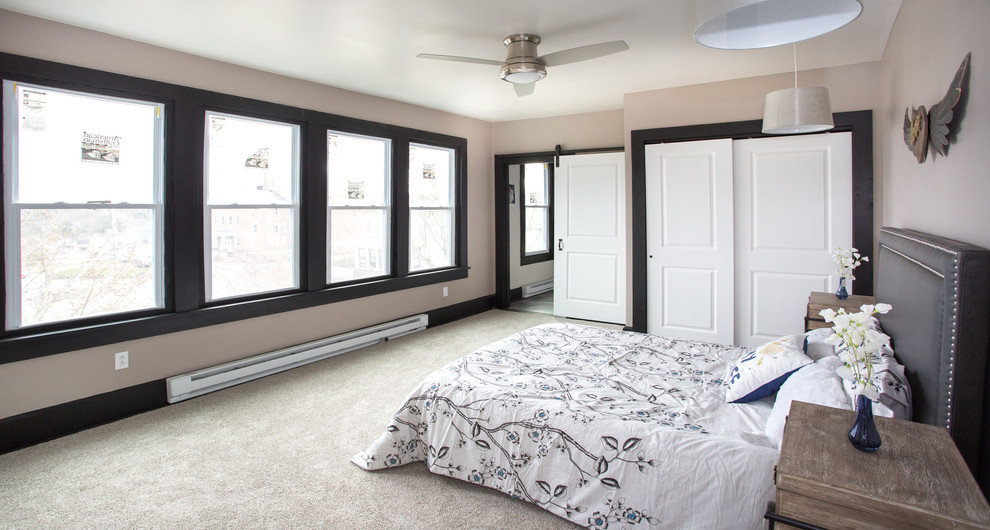 Mid-sized transitional master carpeted and gray floor bedroom photo with gray walls