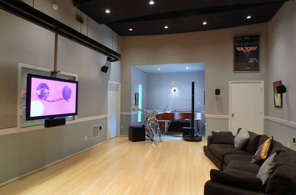 This is an example of an eclectic home theatre in Houston.