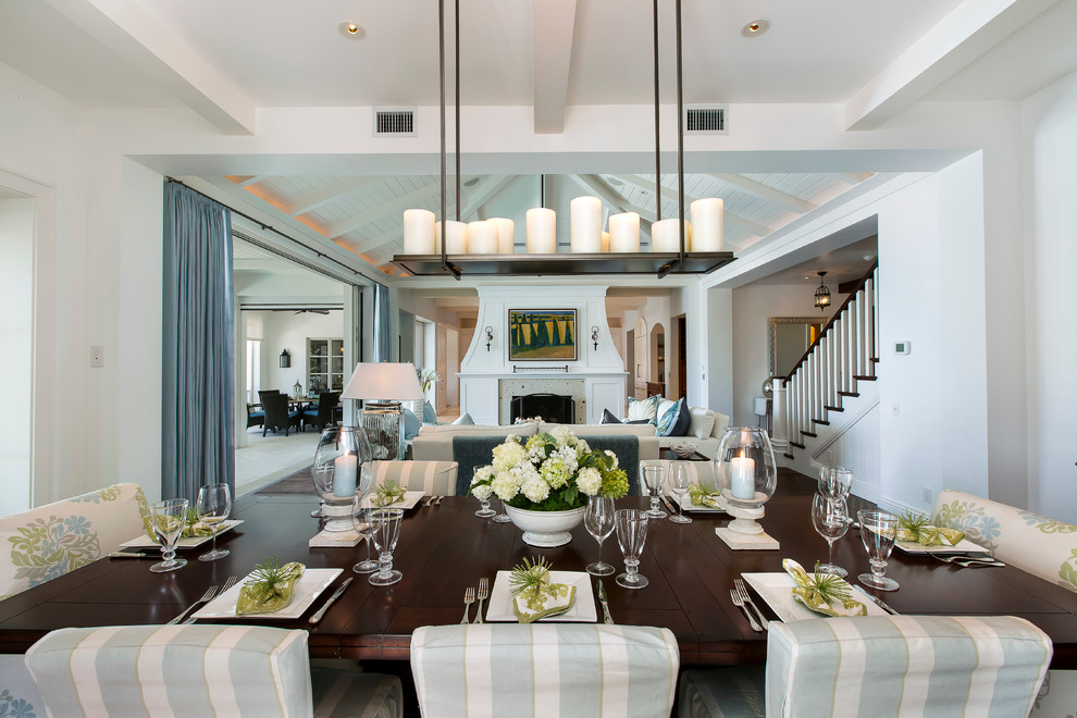 Mid-sized transitional separate dining room in Miami with white walls.