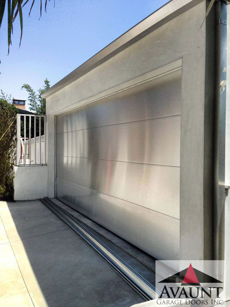 This is an example of a mid-sized contemporary attached garage in Orange County.