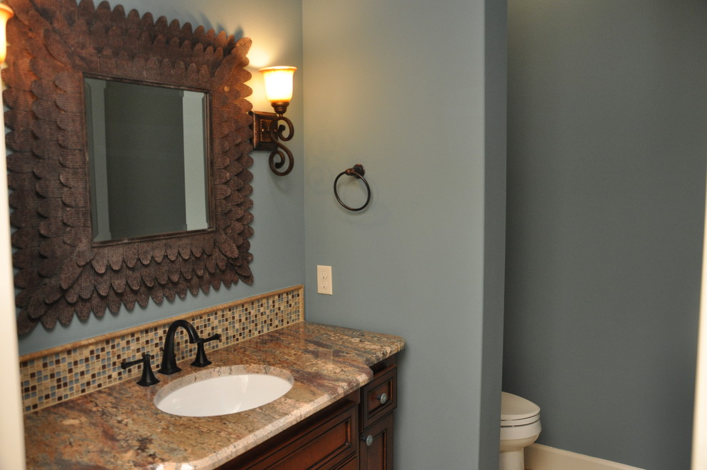 This is an example of a traditional powder room in Austin.