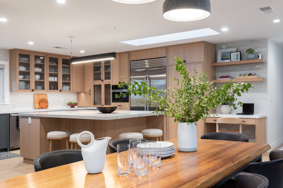 Example of a large trendy light wood floor and brown floor kitchen/dining room combo design in San Francisco with gray walls