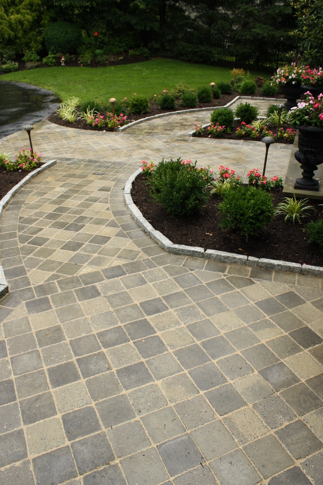 Design ideas for a mid-sized contemporary full sun garden in Philadelphia with concrete pavers.