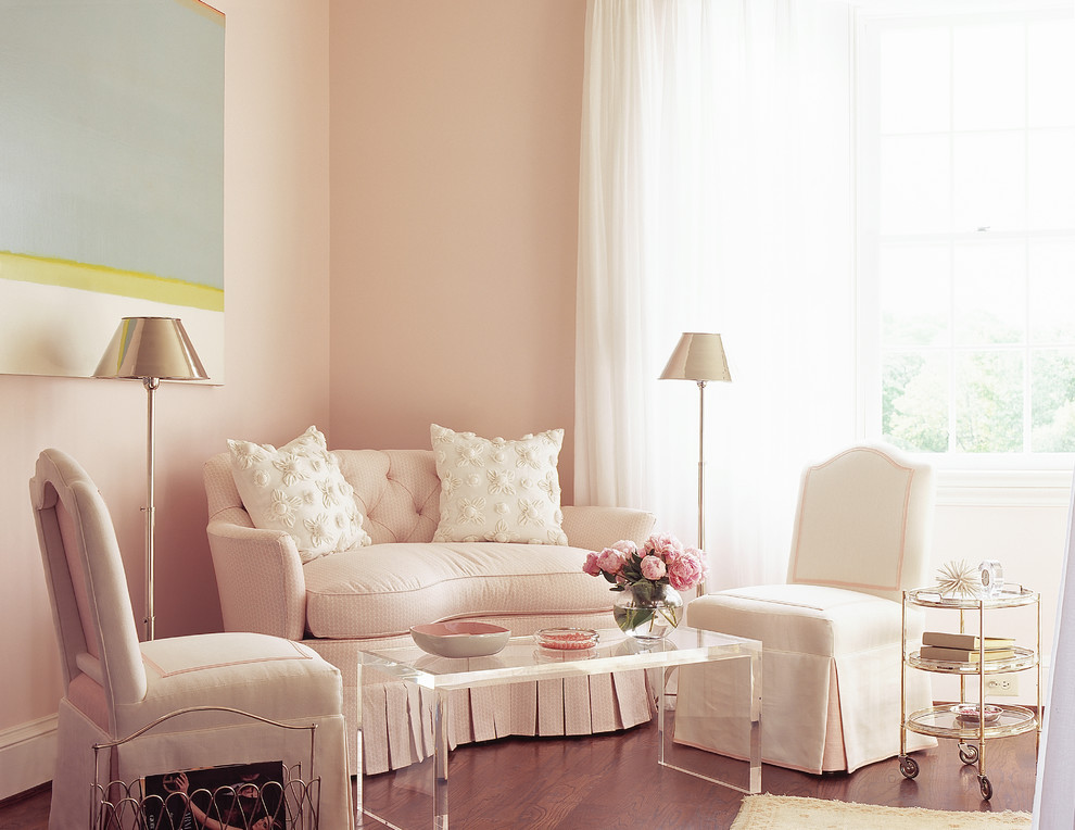 Large master bedroom in Atlanta with pink walls and dark hardwood floors.