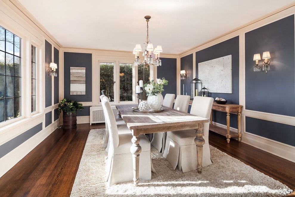 Inspiration for a traditional separate dining room in Seattle with blue walls, medium hardwood floors and brown floor.