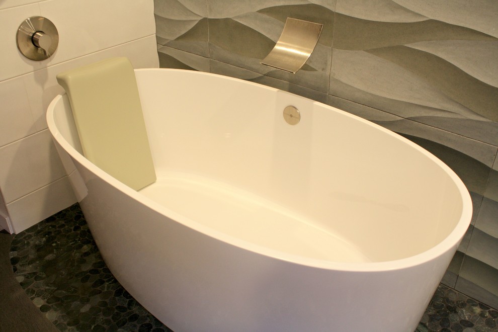 Inspiration for an expansive contemporary master bathroom in San Luis Obispo with flat-panel cabinets, medium wood cabinets, a drop-in tub, a curbless shower, gray tile, cement tile, white walls, pebble tile floors, an undermount sink, recycled glass benchtops, blue floor, an open shower and grey benchtops.