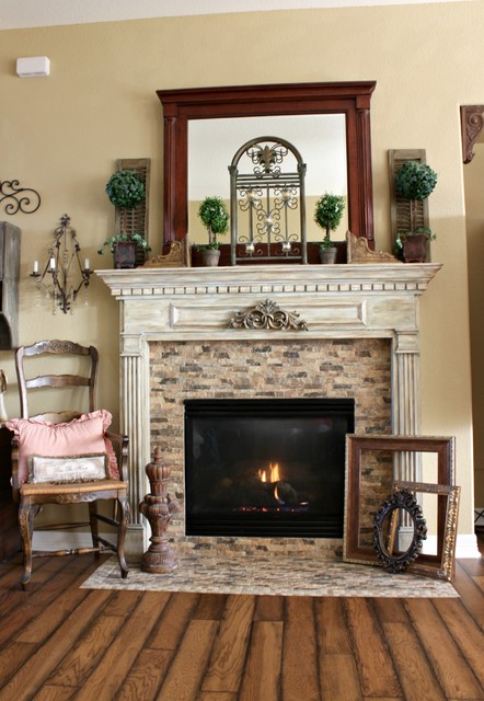 Last spring we transformed our builder grade fireplace into a French Country haven. We ripped out the black granite surround and added porcelain tiles that