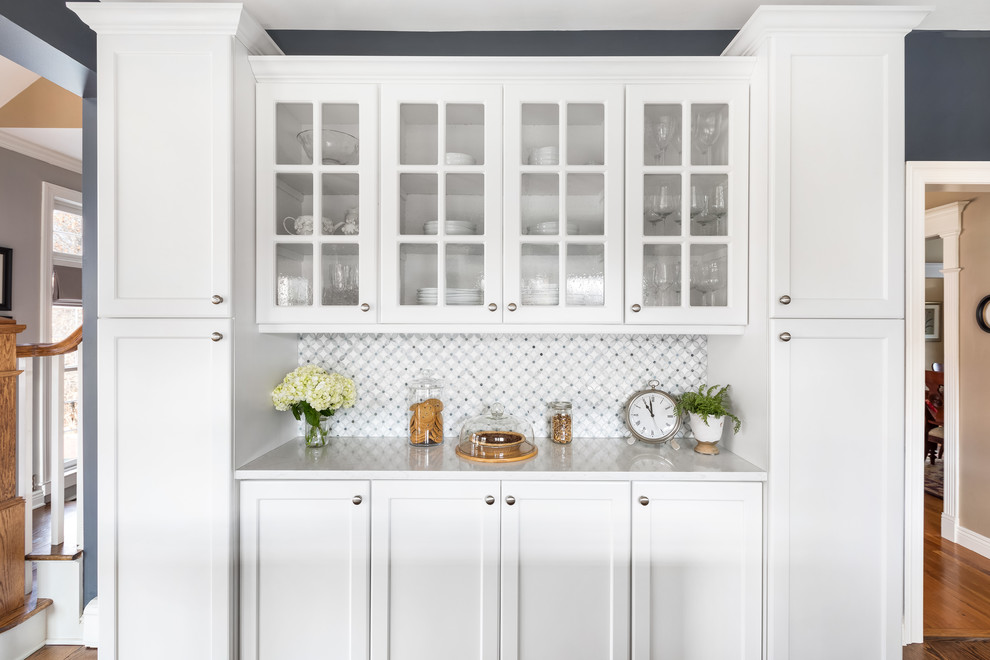 Eat-in kitchen - huge transitional l-shaped dark wood floor and brown floor eat-in kitchen idea in Philadelphia with a single-bowl sink, flat-panel cabinets, white cabinets, quartzite countertops, gray backsplash, ceramic backsplash, stainless steel appliances, an island and white countertops