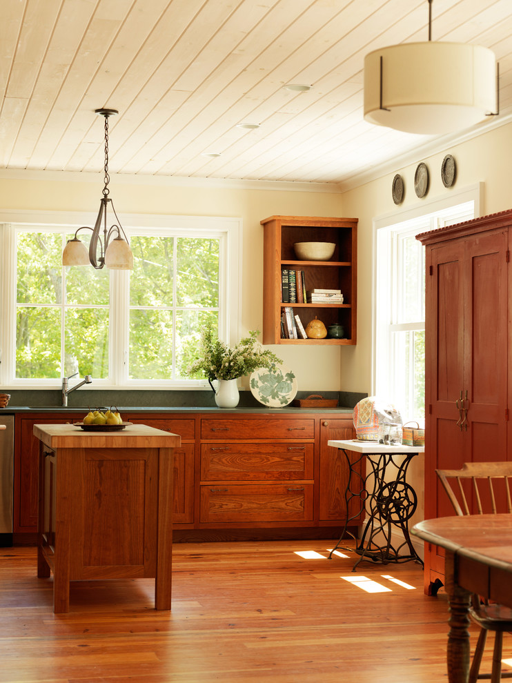 Example of a mid-sized farmhouse l-shaped medium tone wood floor eat-in kitchen design in Burlington with an undermount sink, shaker cabinets, dark wood cabinets, granite countertops, green backsplash, stone slab backsplash, stainless steel appliances and an island