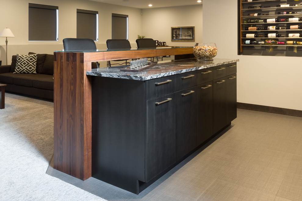 Mid-sized contemporary single-wall seated home bar in Other with an undermount sink, flat-panel cabinets, glass benchtops, blue splashback, glass tile splashback, dark hardwood floors, brown floor and black benchtop.