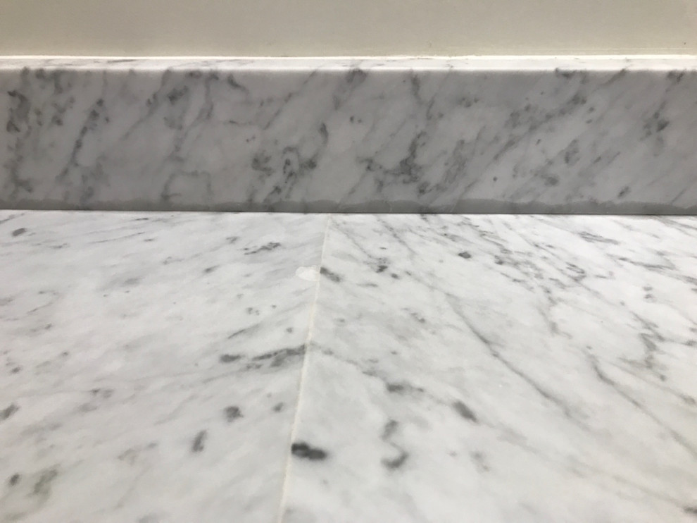 clear silicone caulk stains on marble countertop