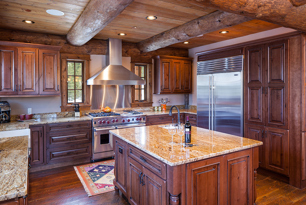 Inspiration for a large rustic u-shaped eat-in kitchen remodel with two islands