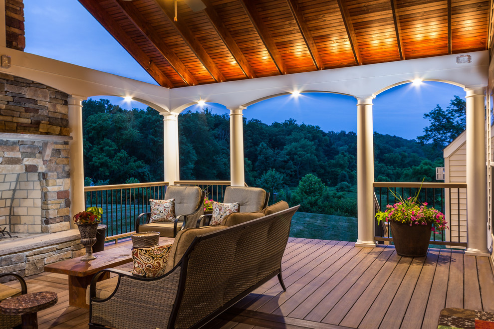 Inspiration for a backyard deck remodel in Baltimore with a roof extension