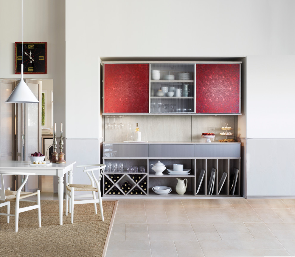 This is an example of a small eclectic single-wall home bar in Phoenix with no sink, flat-panel cabinets, grey splashback, ceramic splashback and beige floor.