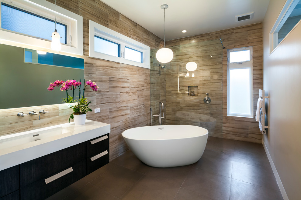 Inspiration for a contemporary bathroom in San Francisco with an undermount sink, flat-panel cabinets, dark wood cabinets, a freestanding tub, a curbless shower, beige tile, porcelain tile, porcelain floors and engineered quartz benchtops.