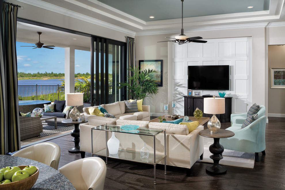 Inspiration for a large transitional open concept living room in Tampa with brown walls, carpet and a wall-mounted tv.