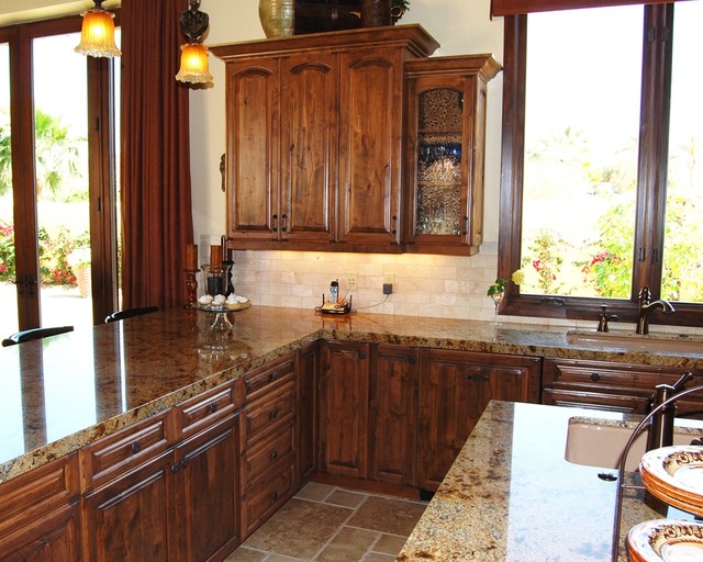 Tuscan Kitchen With Antique Bubble Glass Doors Mediterranean
