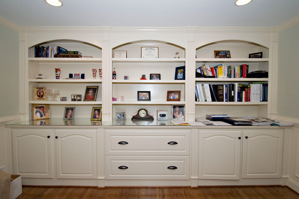 Inspiration for a transitional study room in Atlanta with medium hardwood floors and a built-in desk.