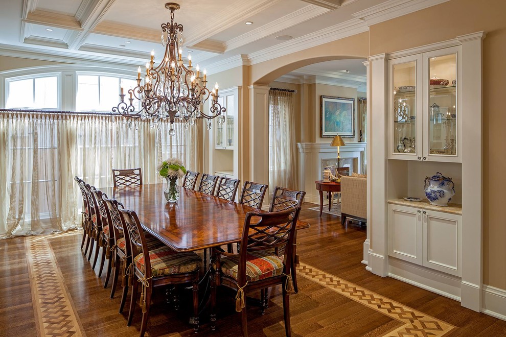 Inspiration for a traditional separate dining room in Toronto with beige walls and medium hardwood floors.