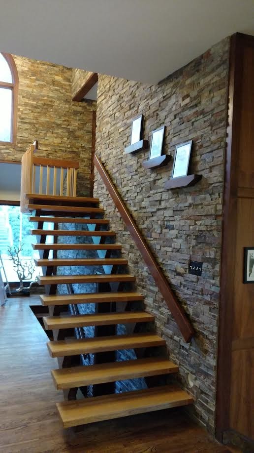 Inspiration for a mid-sized rustic wooden straight open and wood railing staircase remodel