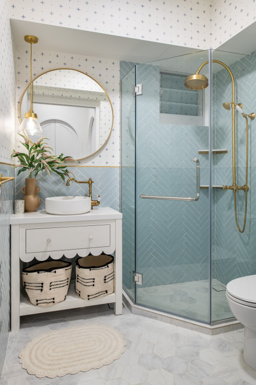 Blue and White Bathroom with Patterned Wallpaper and Brass Details