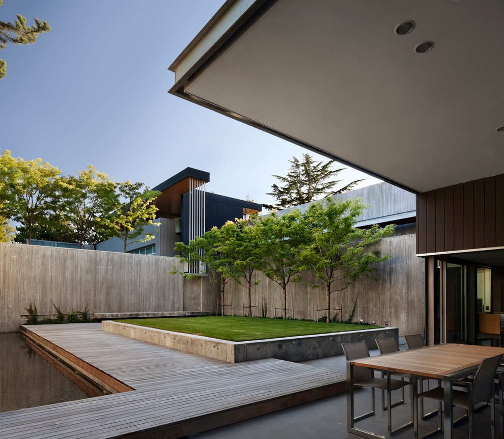 Inspiration for a modern garden in Seattle with a water feature and decking.