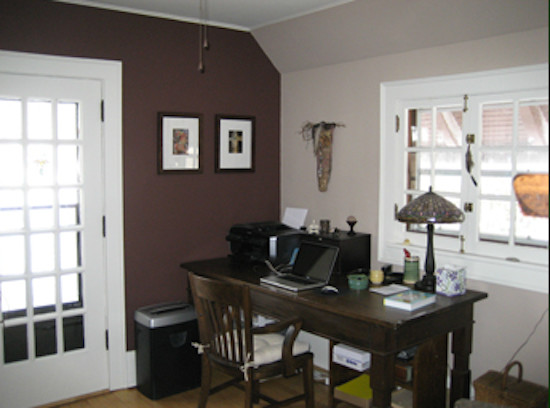 Example of a mid-sized freestanding desk light wood floor study room design in Milwaukee with beige walls