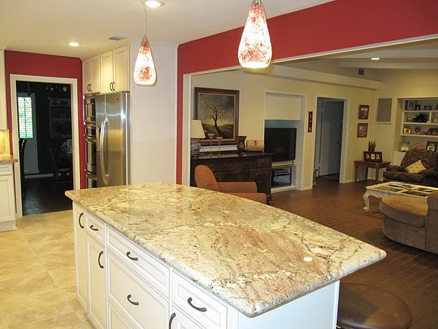 Large transitional u-shaped porcelain tile and beige floor eat-in kitchen photo in Houston with a double-bowl sink, shaker cabinets, white cabinets, granite countertops, beige backsplash, travertine backsplash, stainless steel appliances and an island