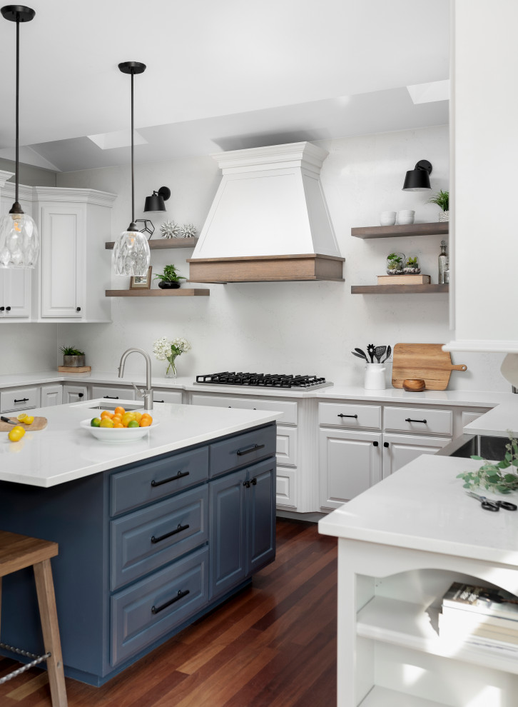 Large transitional u-shaped medium tone wood floor and vaulted ceiling eat-in kitchen photo with a farmhouse sink, raised-panel cabinets, gray cabinets, quartz countertops, white backsplash, quartz backsplash, stainless steel appliances, an island and white countertops