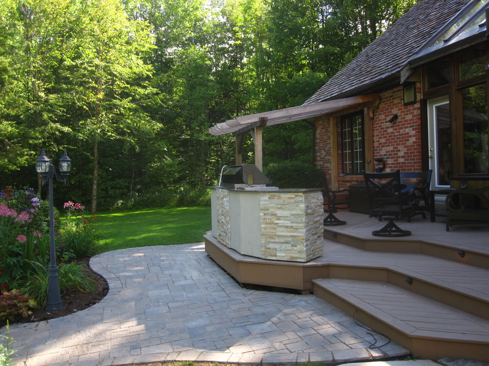 Example of a mid-sized transitional backyard outdoor kitchen deck design in Ottawa