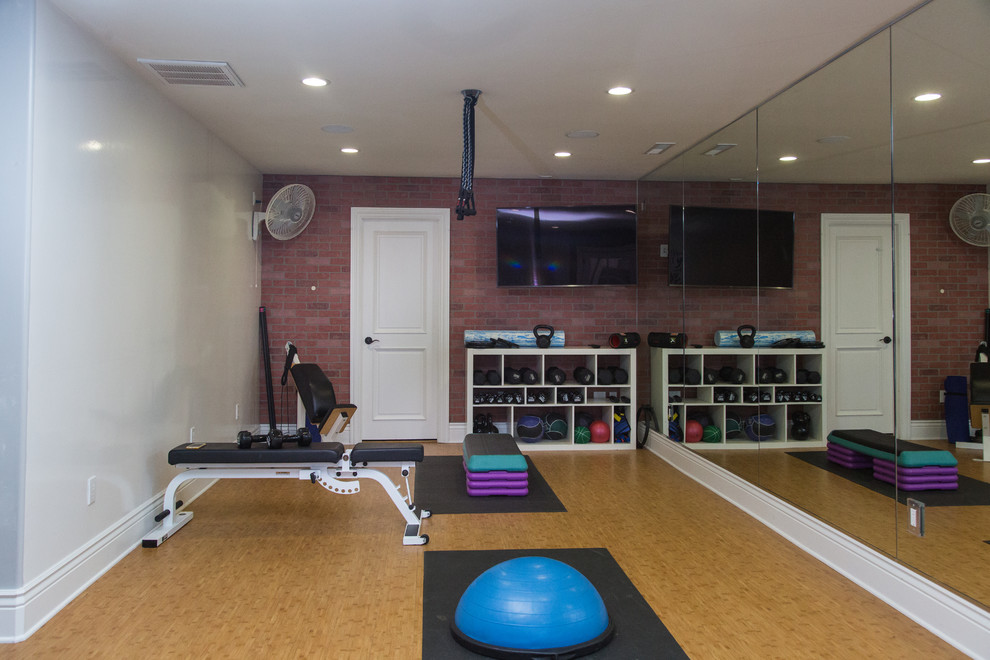 This is an example of a mid-sized transitional multipurpose gym in Other with multi-coloured walls, bamboo floors and beige floor.