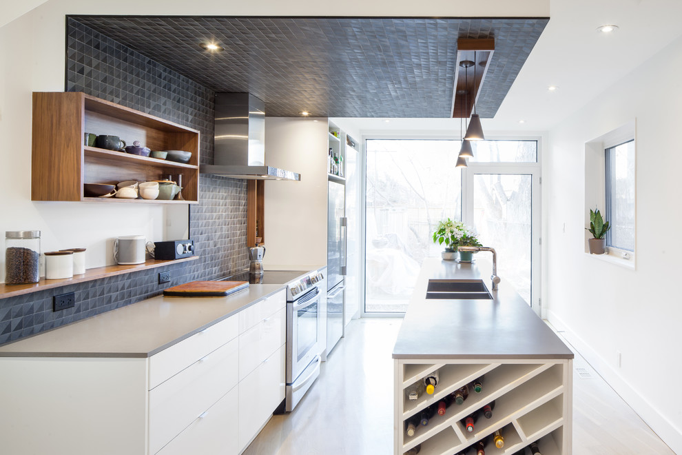 Photo of a contemporary kitchen in Toronto with with island, a double-bowl sink, open cabinets, black splashback and stainless steel appliances.