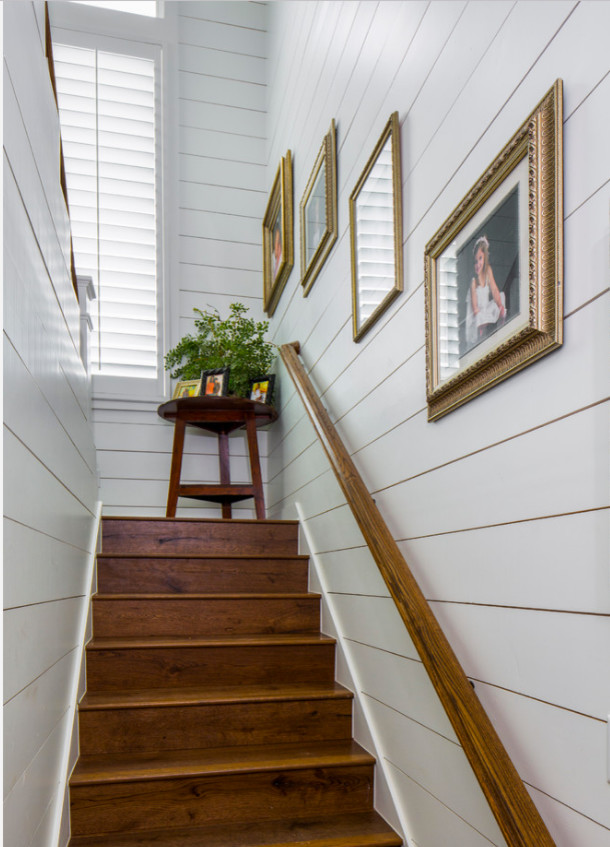 This is an example of a large country wood straight staircase in Austin with wood risers.