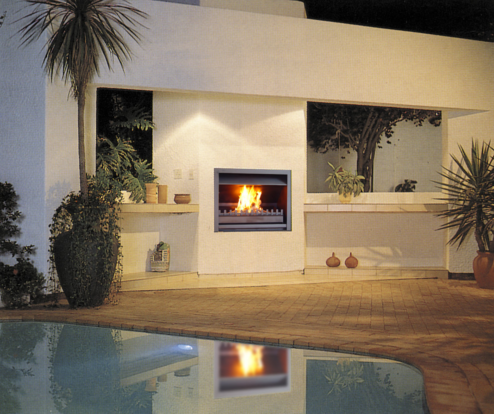 Mid-sized modern backyard deck in Brisbane with a fire feature and no cover.