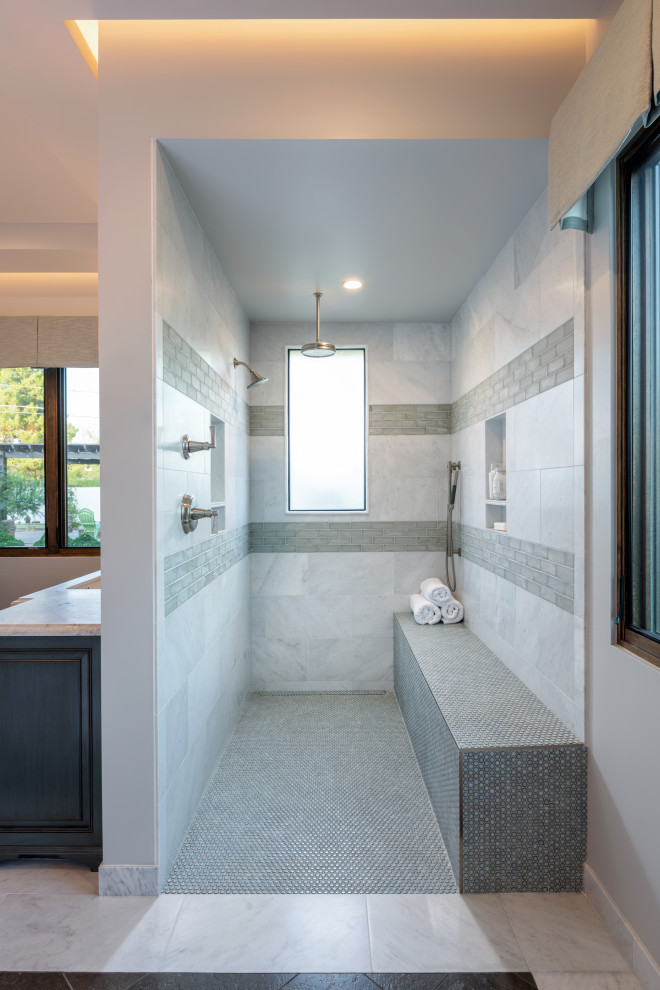 Inspiration for a mid-sized country master bathroom in Phoenix with recessed-panel cabinets, grey cabinets, a curbless shower, a two-piece toilet, mosaic tile, grey walls, marble floors, an undermount sink, marble benchtops, white floor, an open shower, white benchtops, gray tile and white tile.