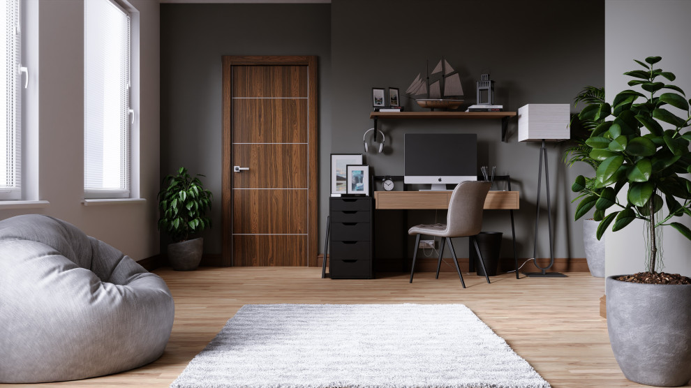 This is an example of a small home studio in New York with grey walls, laminate floors and brown floors.