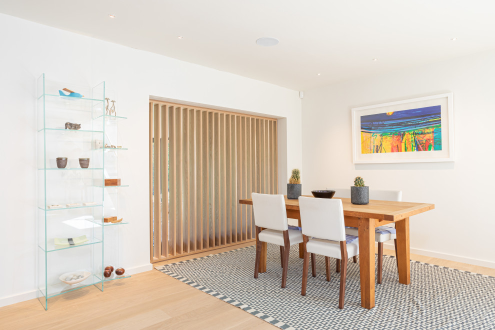 Design ideas for a contemporary dining room in Sussex.