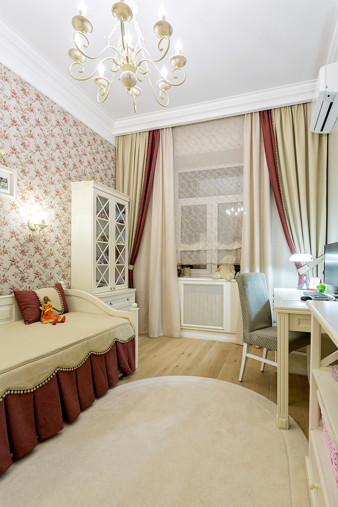 Photo of a traditional teen room for girls in Moscow with multi-coloured walls and light hardwood floors.