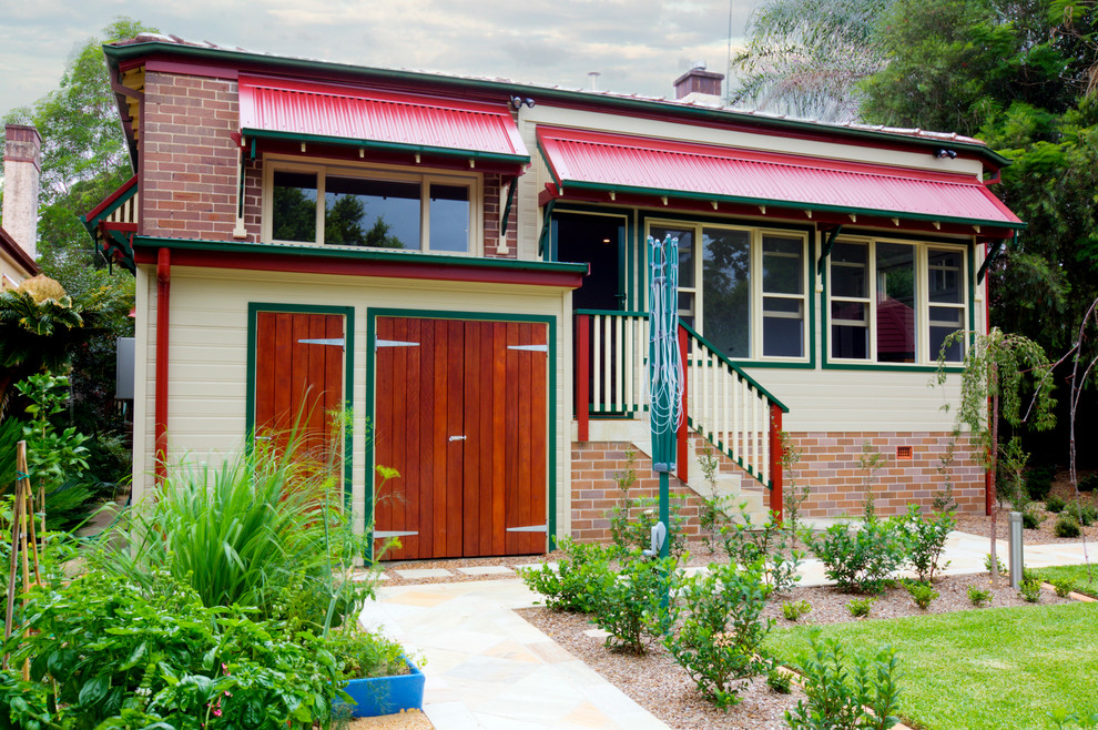 Contemporary one-storey beige exterior in Sydney with wood siding.