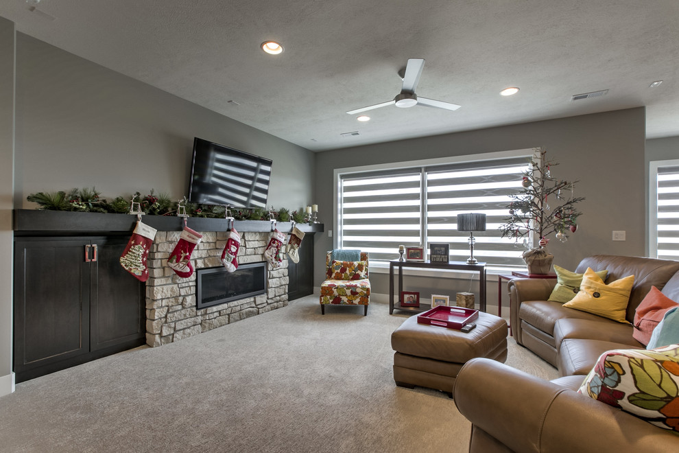 Inspiration for a transitional walk-out carpeted basement remodel in Omaha with a ribbon fireplace and a stone fireplace