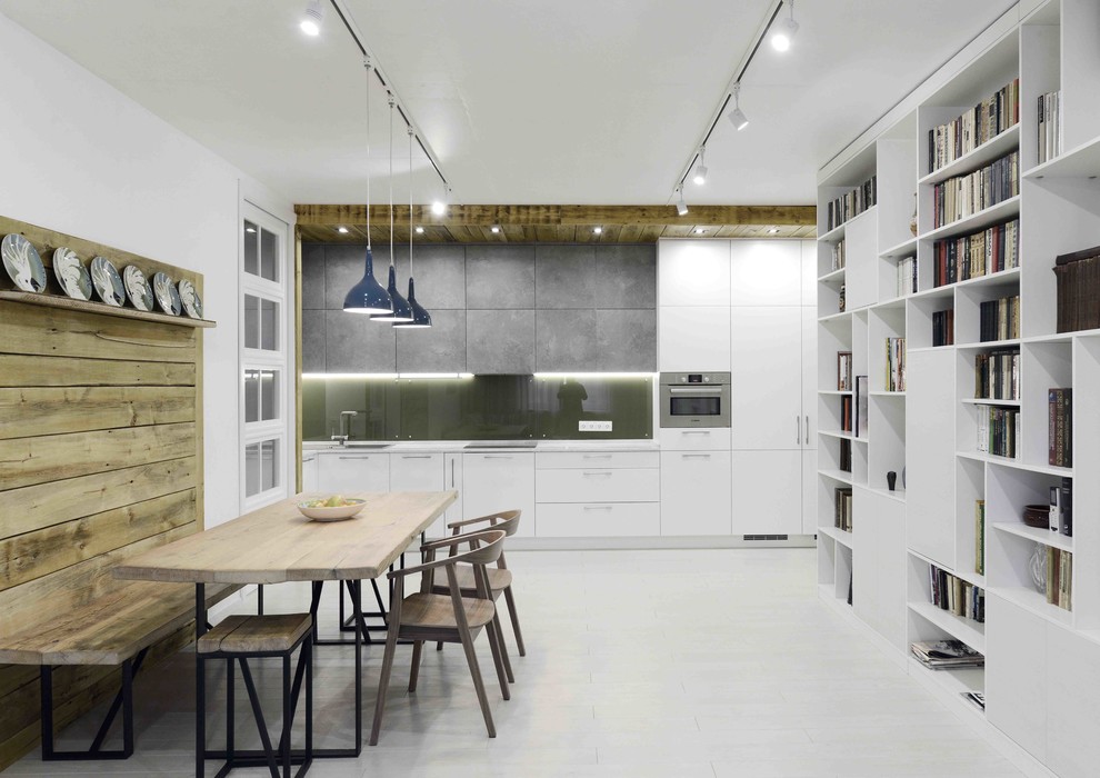 Design ideas for a large contemporary single-wall open plan kitchen in Moscow with light hardwood floors, flat-panel cabinets, white cabinets, stainless steel appliances and no island.