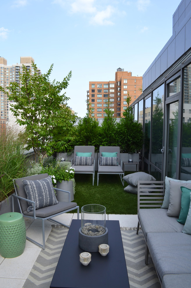 Contemporary rooftop and rooftop deck in New York with no cover.