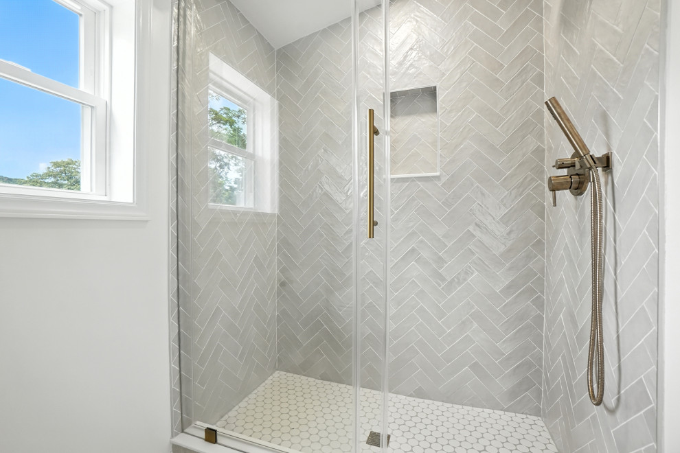 Herringbone Tile Shower with Brass Fixtures