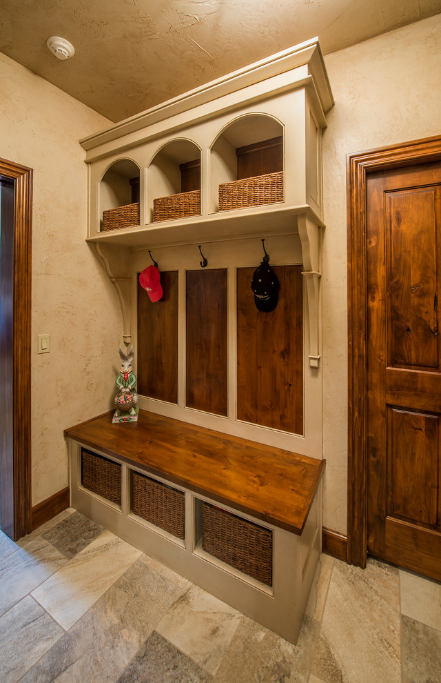 Hallway - mid-sized rustic ceramic tile hallway idea with beige walls