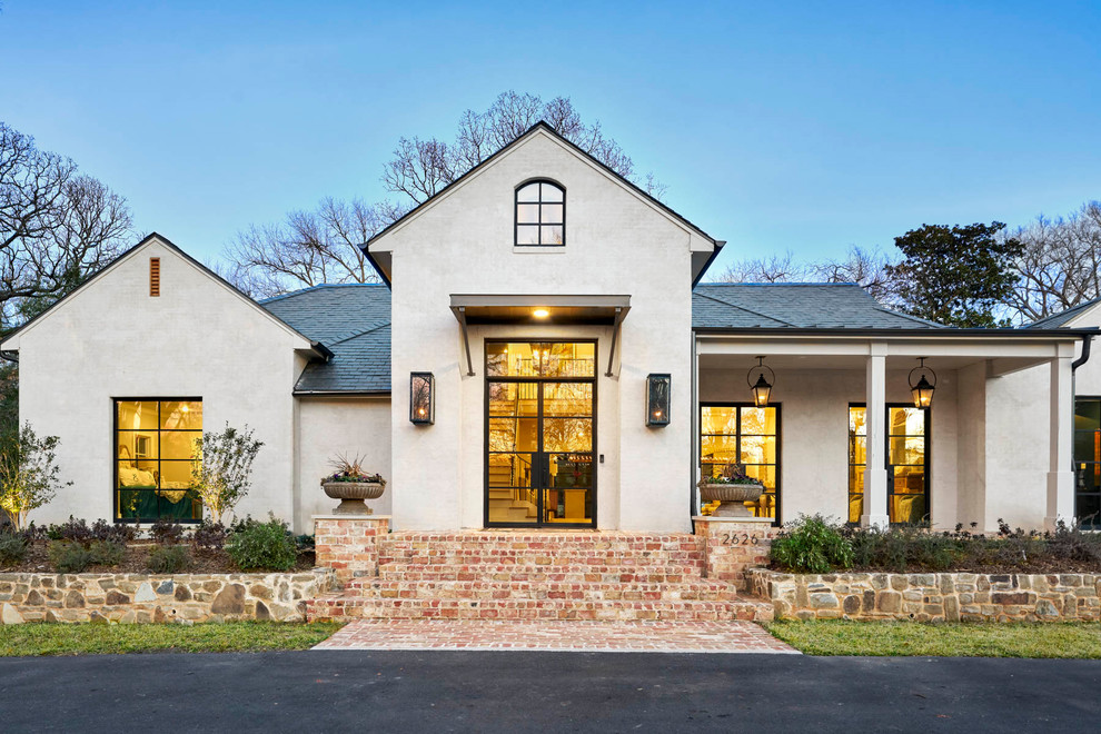Photo of a mid-sized contemporary one-storey stucco beige house exterior in Dallas with a shingle roof and a hip roof.