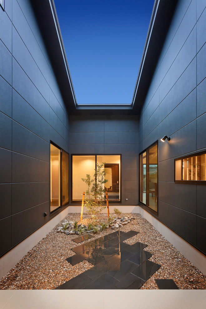 Photo of a contemporary courtyard patio in Other.