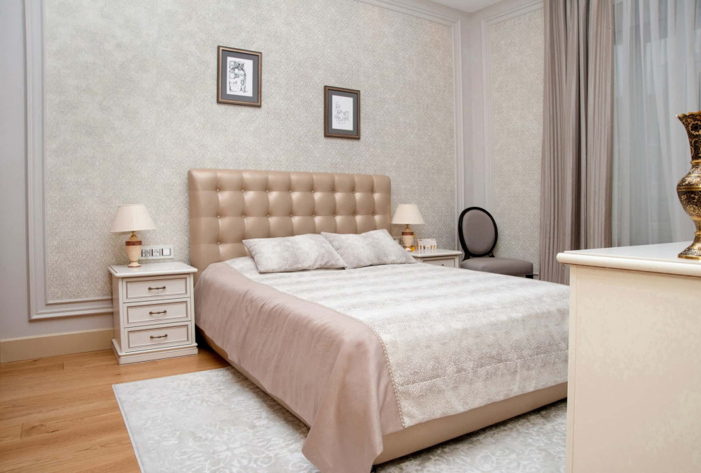 Inspiration for a medium sized traditional master bedroom in Moscow with white walls, medium hardwood flooring and wallpapered walls.