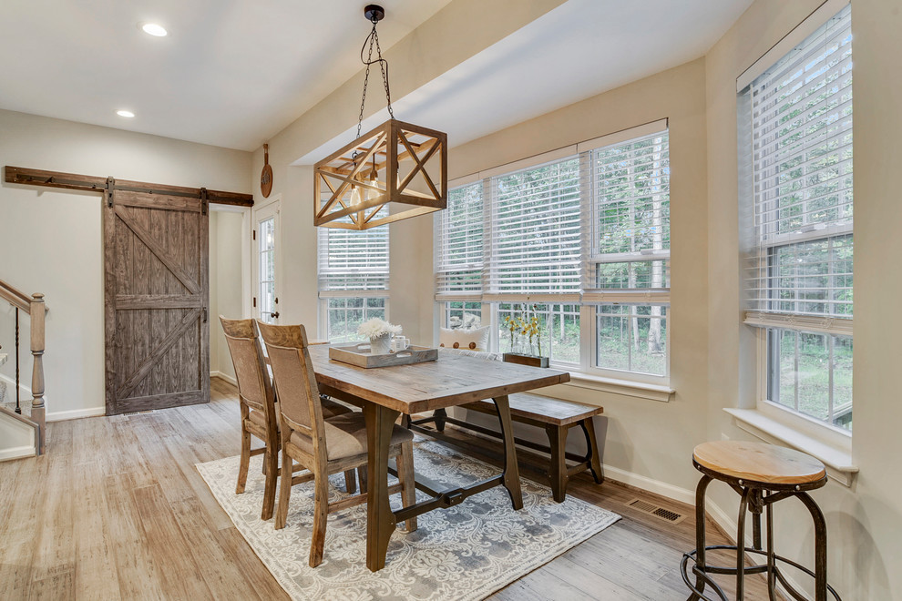 Mid-sized country kitchen/dining combo in DC Metro with bamboo floors and grey floor.