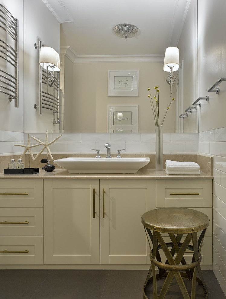 Photo of a contemporary bathroom in Moscow with recessed-panel cabinets, beige cabinets, white tile, beige walls and a vessel sink.